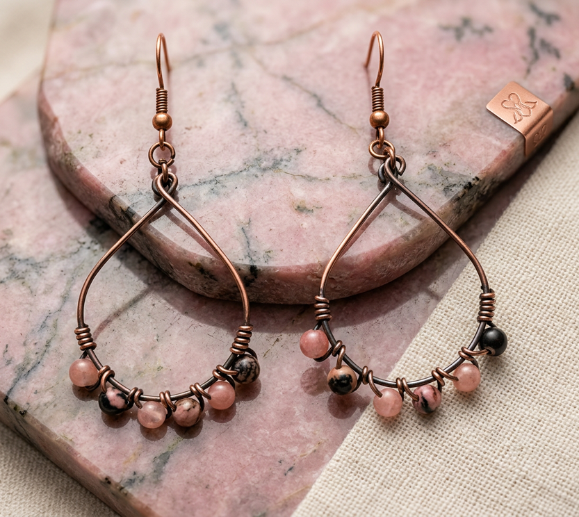 Handcrafted copper hoop earrings with zebra pink jasper and pink quartz stones, approximately 2 inches long