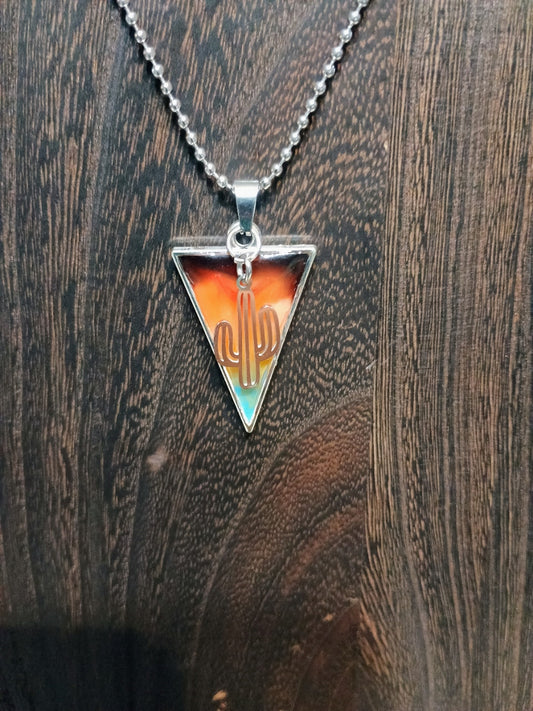 Desert Sunset Cactus Pendant Necklace on wood background