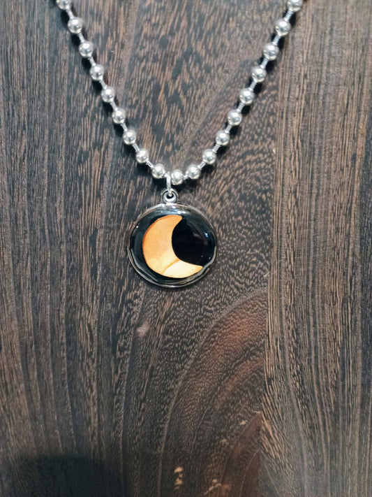 Crescent Moon Avocado Pit Pendant Necklace - original photo on wood background