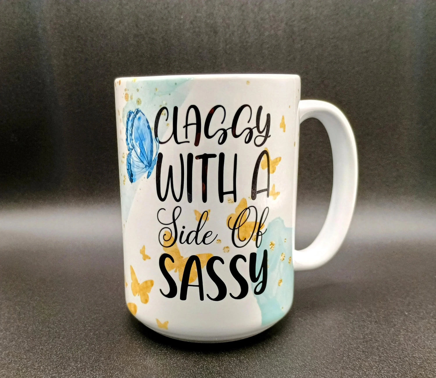 White ceramic mug with colorful sun and moon celestial face design and stars