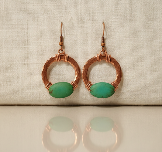 Hammered copper hoop earrings with natural turquoise stone and wire-wrapped detail