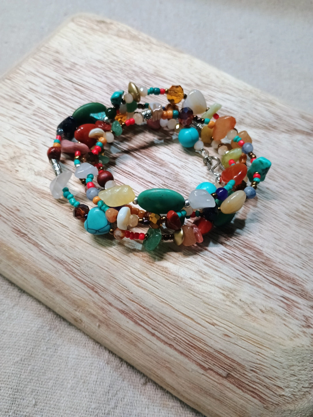 Multicolored beaded bracelet on a wooden surface