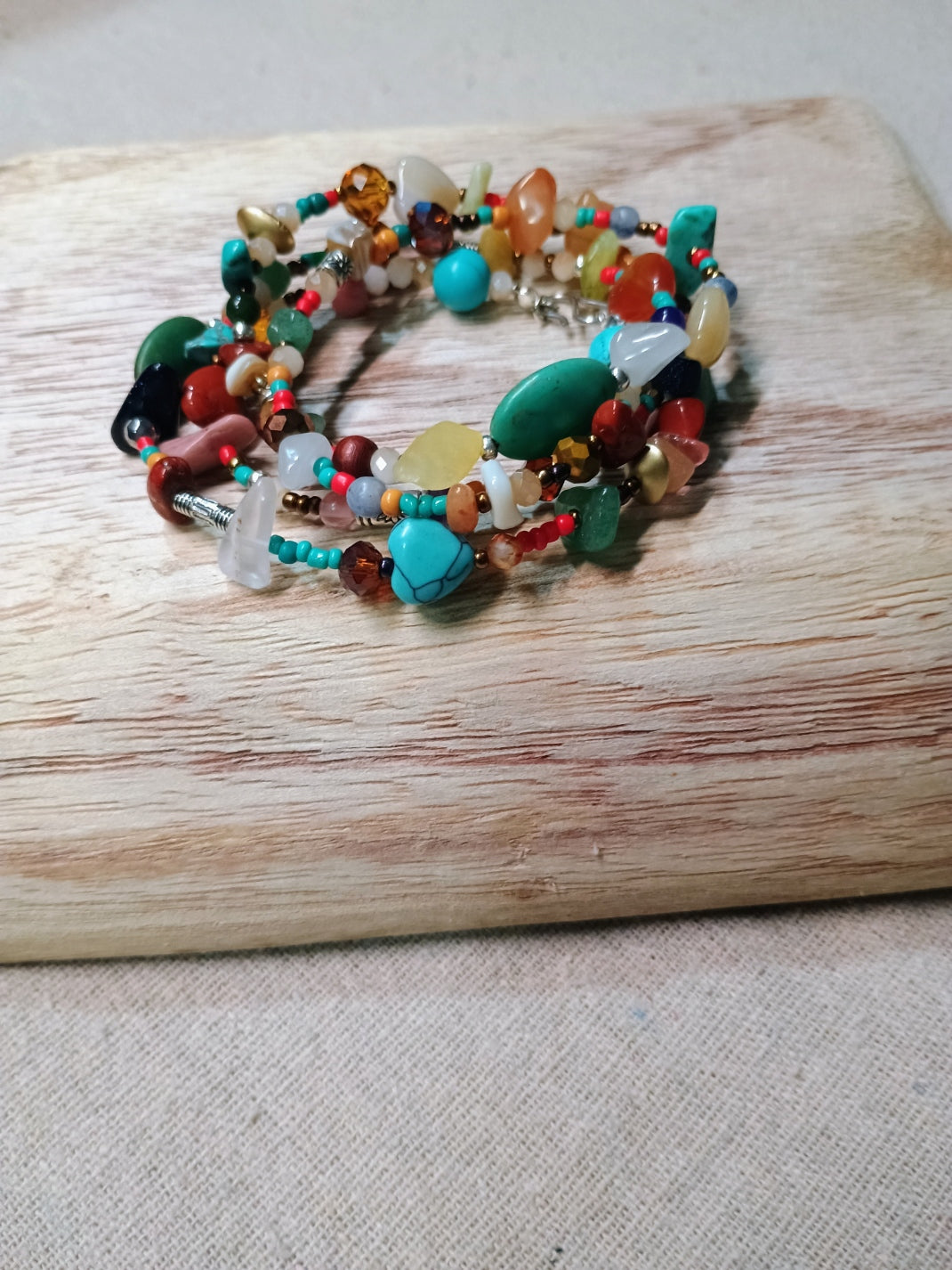 Colorful beaded bracelet on a wooden surface