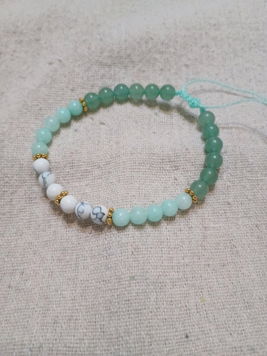 Handcrafted bracelet with amazonite, white turquoise and green aventurine beads with gold hematite accents on Brazilian wax cord
