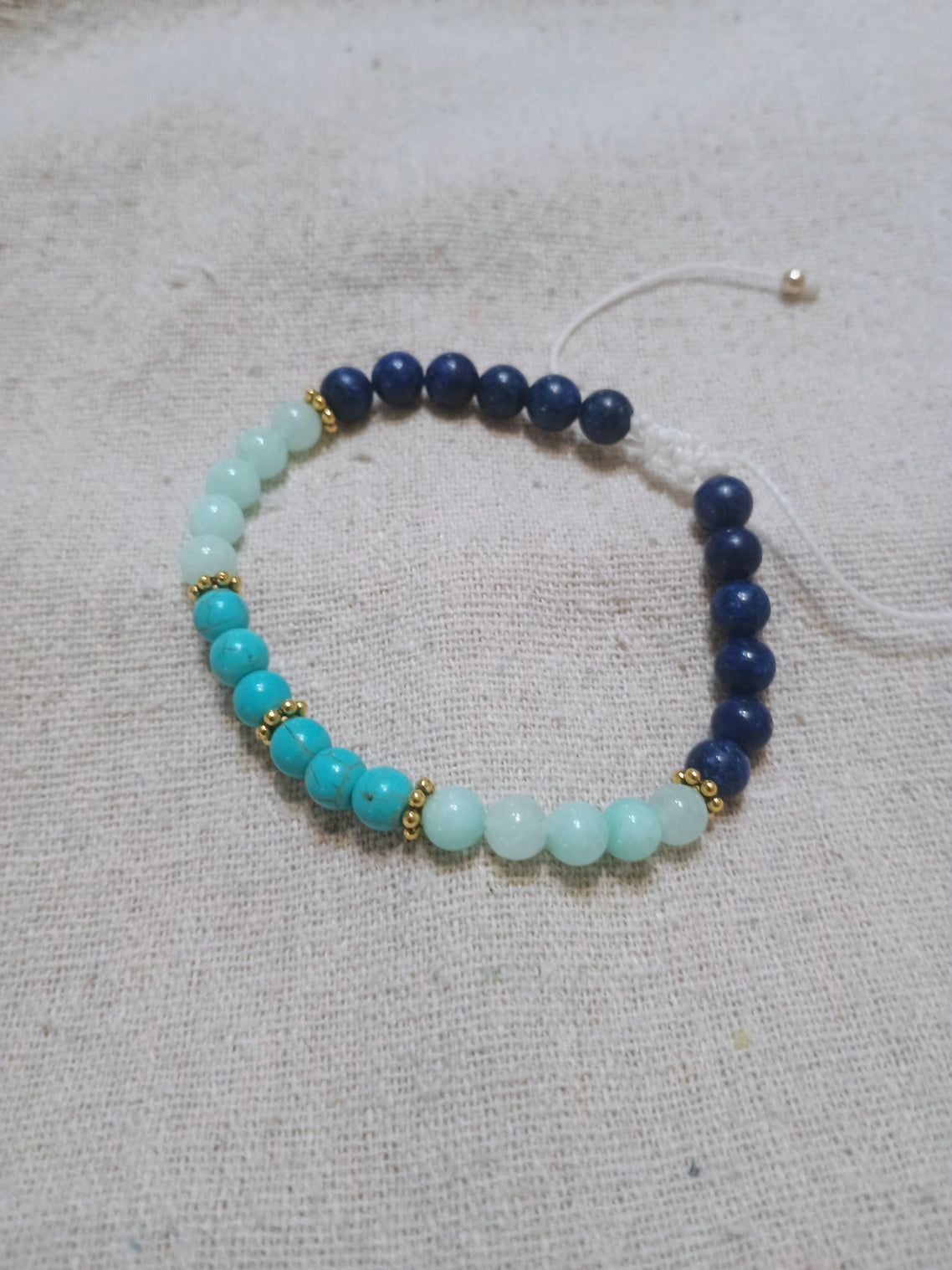 Handcrafted bracelet with lapis lazuli, turquoise and amazonite beads with gold hematite accents on Brazilian wax cord