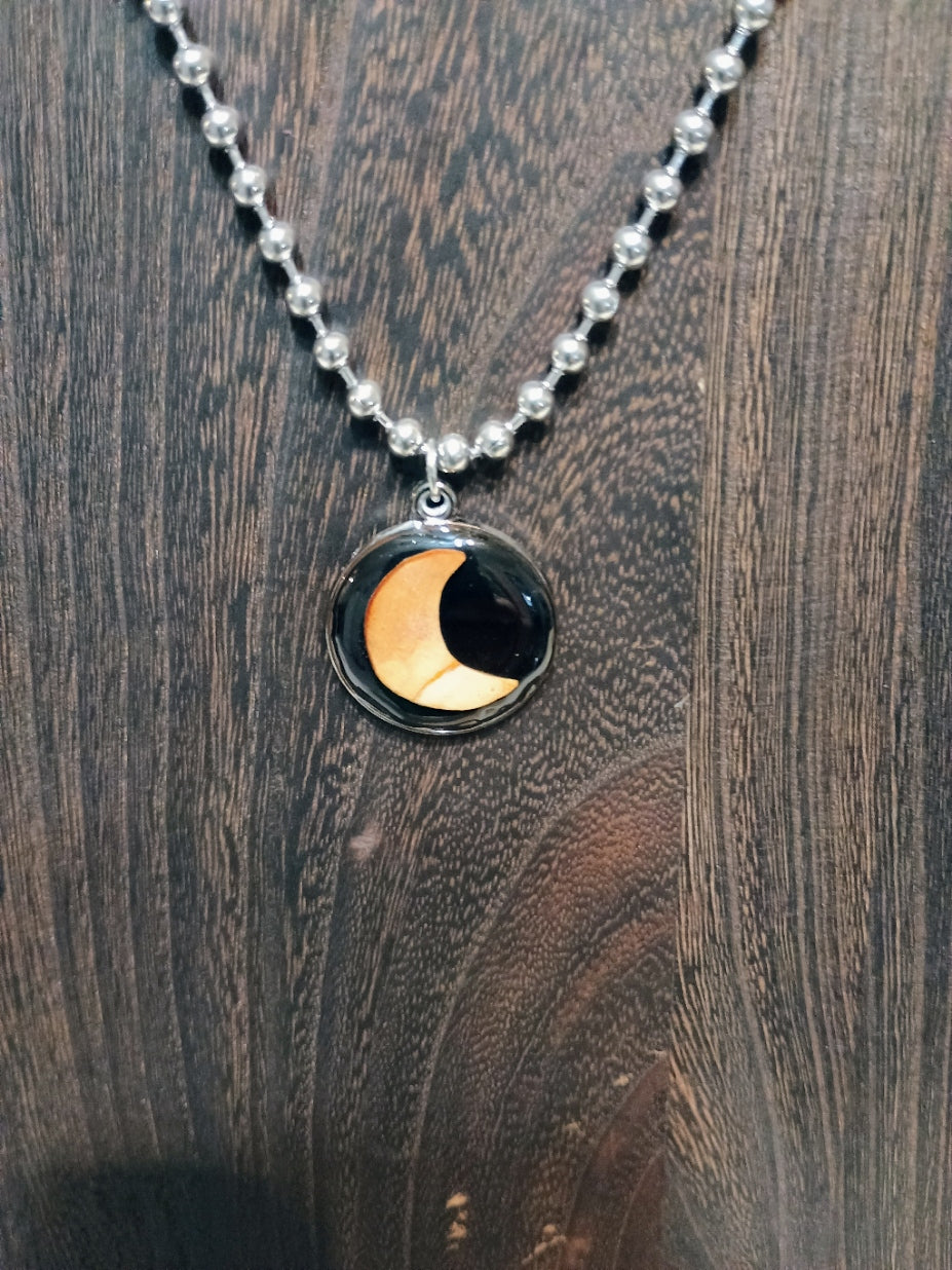 Crescent Moon Avocado Pit Pendant Necklace - original photo on wood background