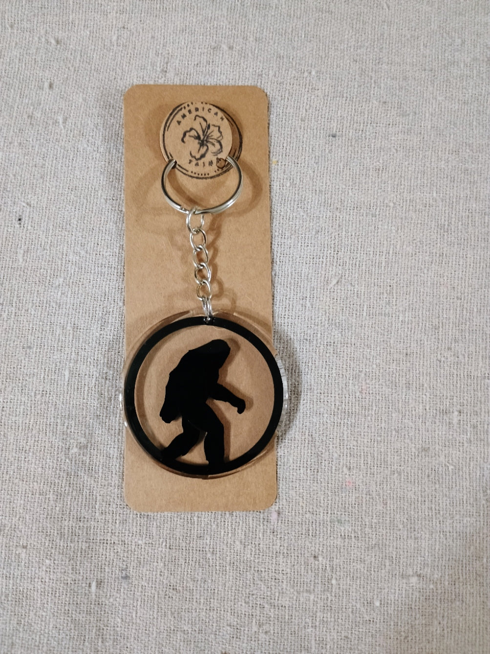 Keychain with a silhouette design on a cardboard backing