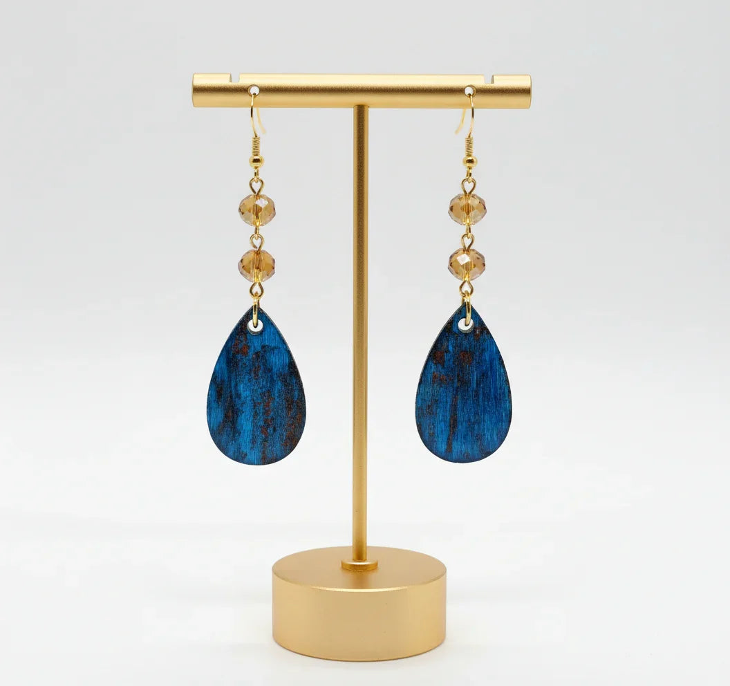 Pair of handcrafted blue teardrop earrings with amber beads on gold stand