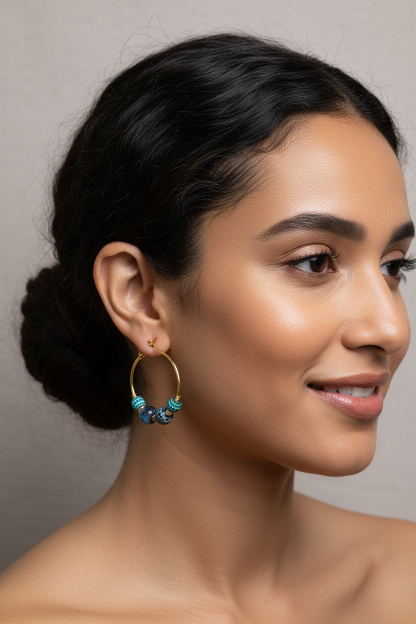 Minimalist handmade gold hoop earrings with blue stone beads