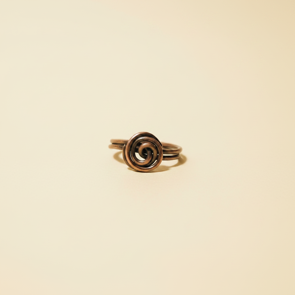 Copper Spiral Ring on Cream Background