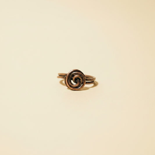 Copper Spiral Ring on Cream Background