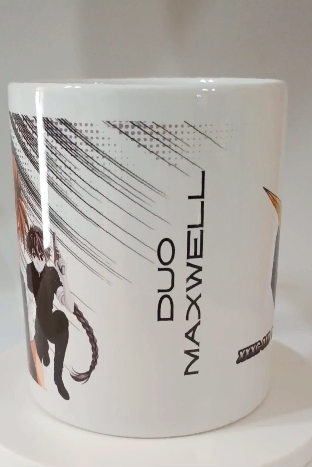 White ceramic mug featuring anime-style character with braid, gun, and text 'Duo Maxwell'