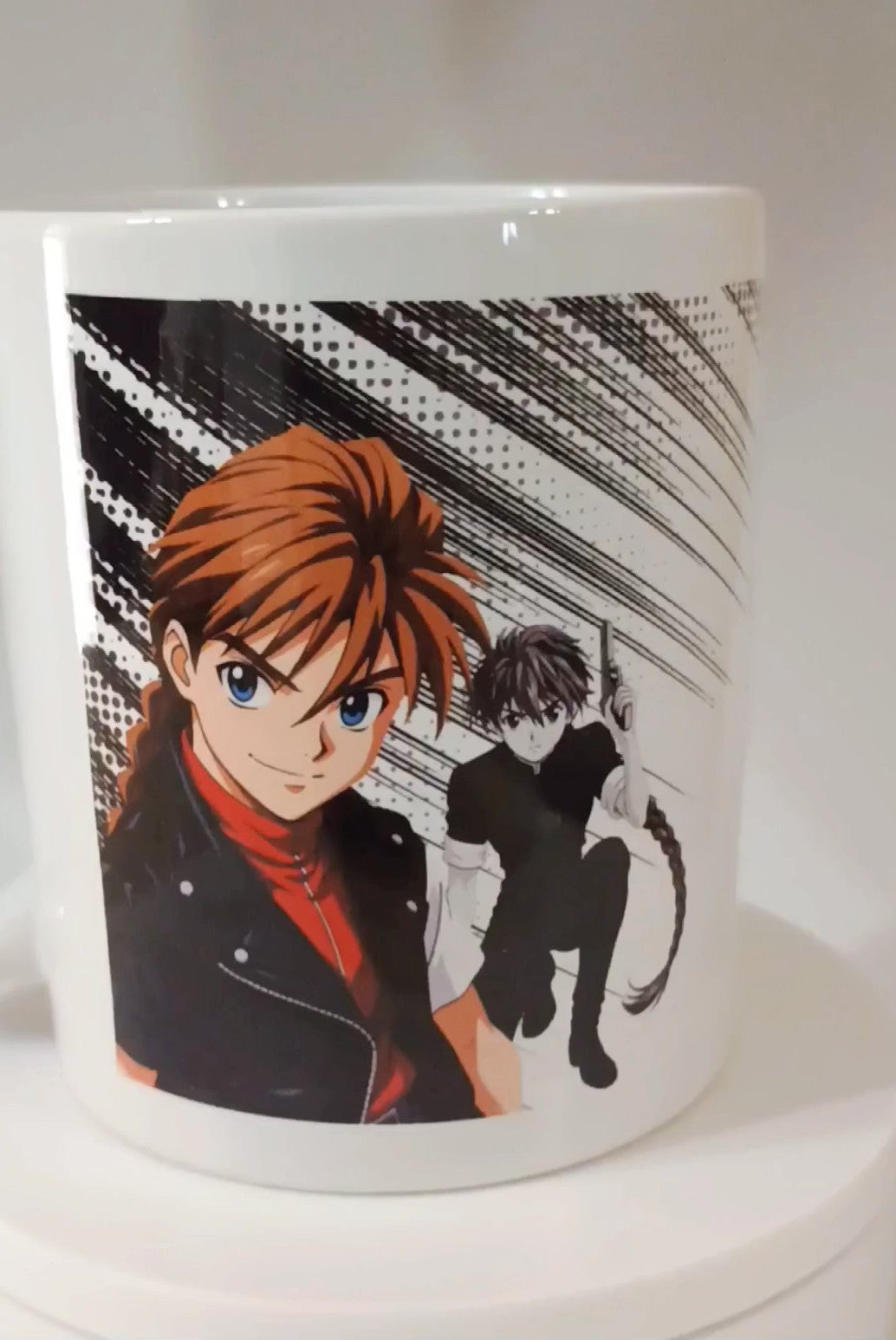 White ceramic mug featuring vibrant anime characters with dynamic black and white background design