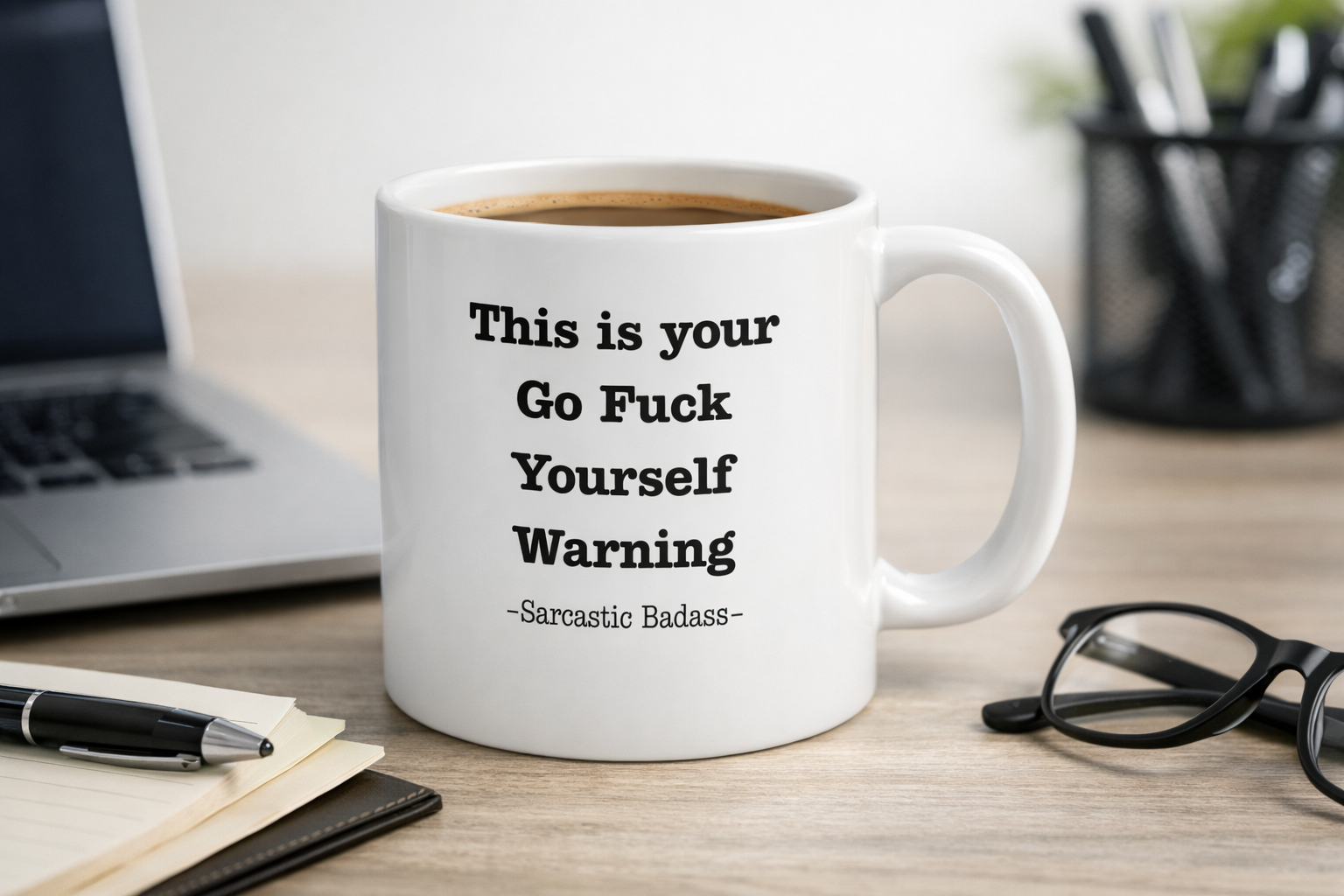 White ceramic mug with This is your Go F*** Yourself Warning Sarcastic Badass quote on office desk