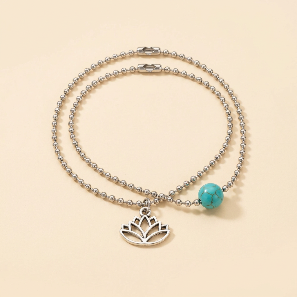 Lotus and turquoise-colored bead bracelet set on a cream background