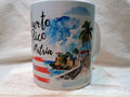 White mug with Puerto Rico text, coastal fort illustration, palm trees, and red brush strokes