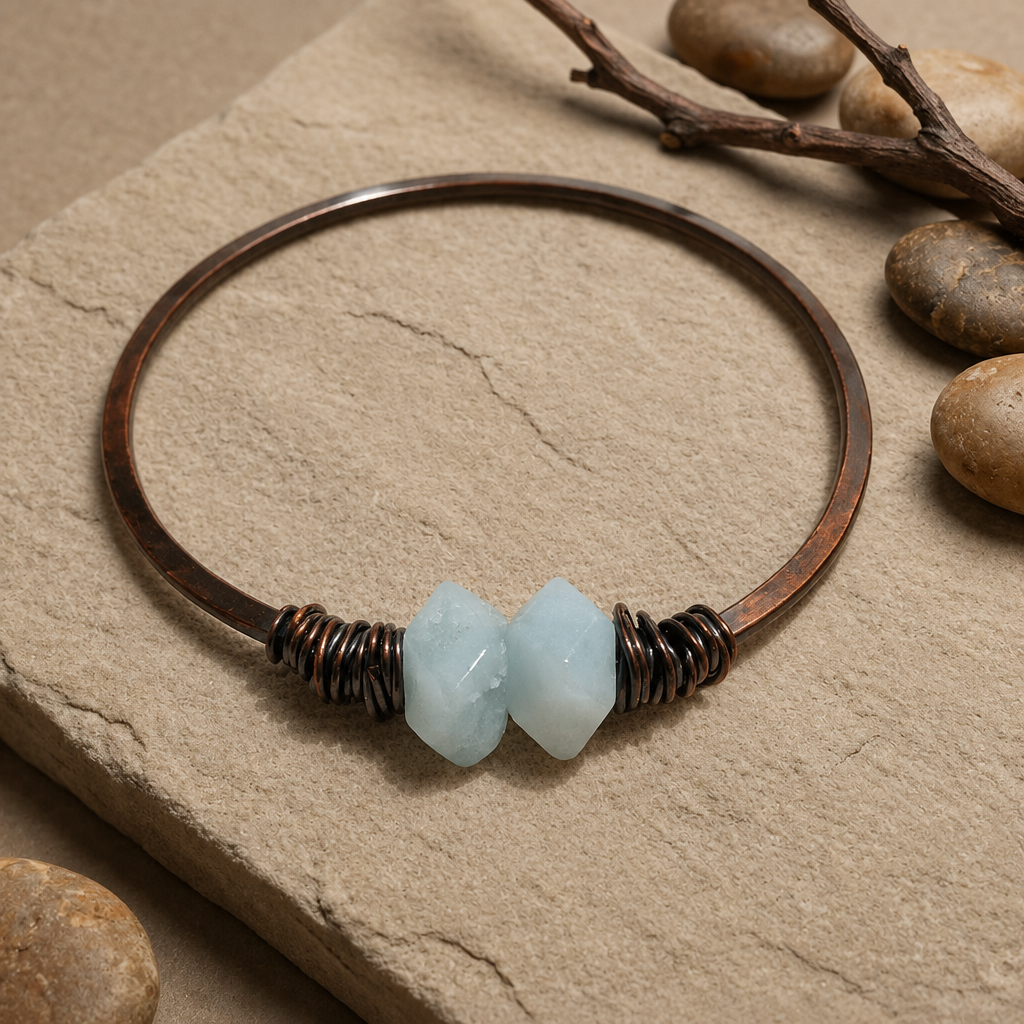 Pale-blue copper bracelet styled on warm natural stone