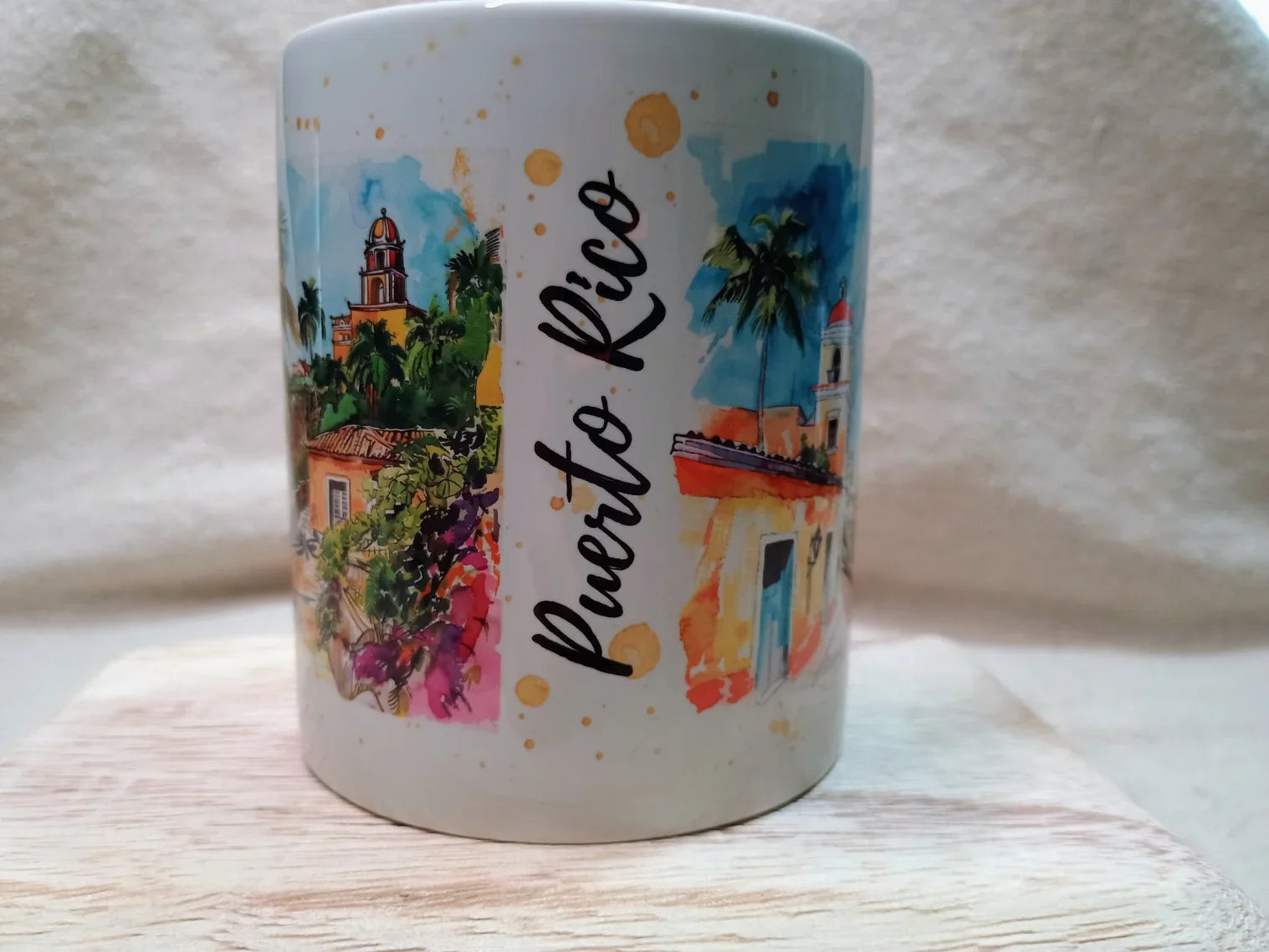 White mug with colorful Puerto Rico cityscape illustrations and handwritten Puerto Rico text