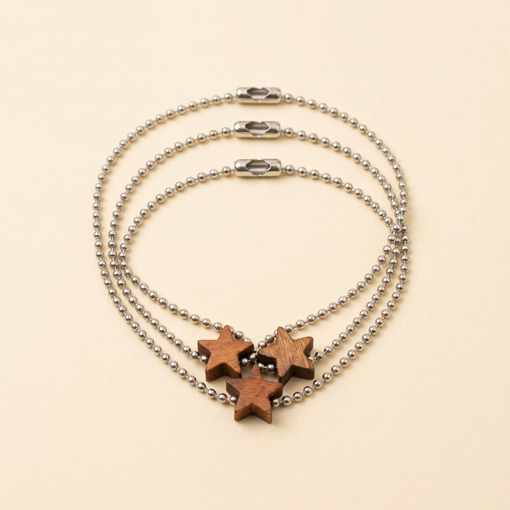 Revised product shot of three wooden star ball-chain bracelets