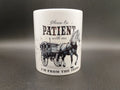 White ceramic mug with vintage horse and carriage graphic and text about being from the 1900s