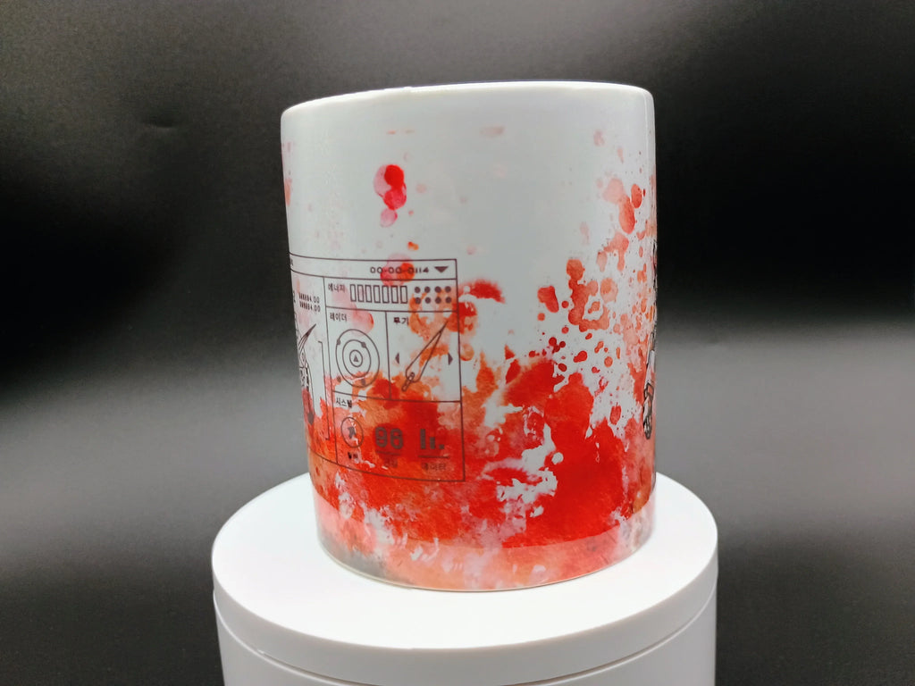 White ceramic mug with red paint splatter and technical schematic design on black background