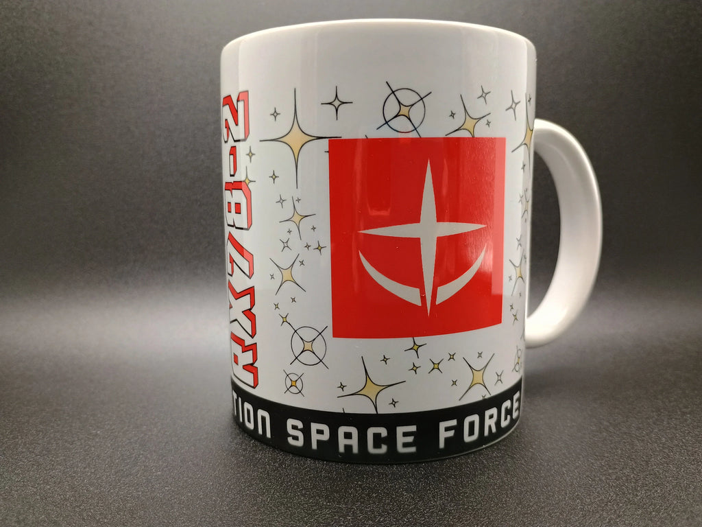 White mug featuring red and white NASA logo, star patterns, and 'SPACE FORCE' text on black band