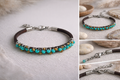 Bracelet with turquoise beads and leather strap on a neutral background